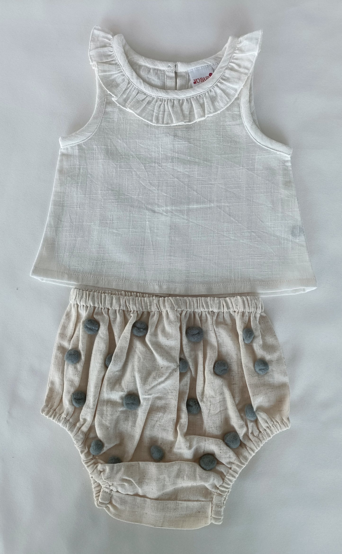 White Ruffle Neck Top & Ivory Diaper Cover With Pom-Poms