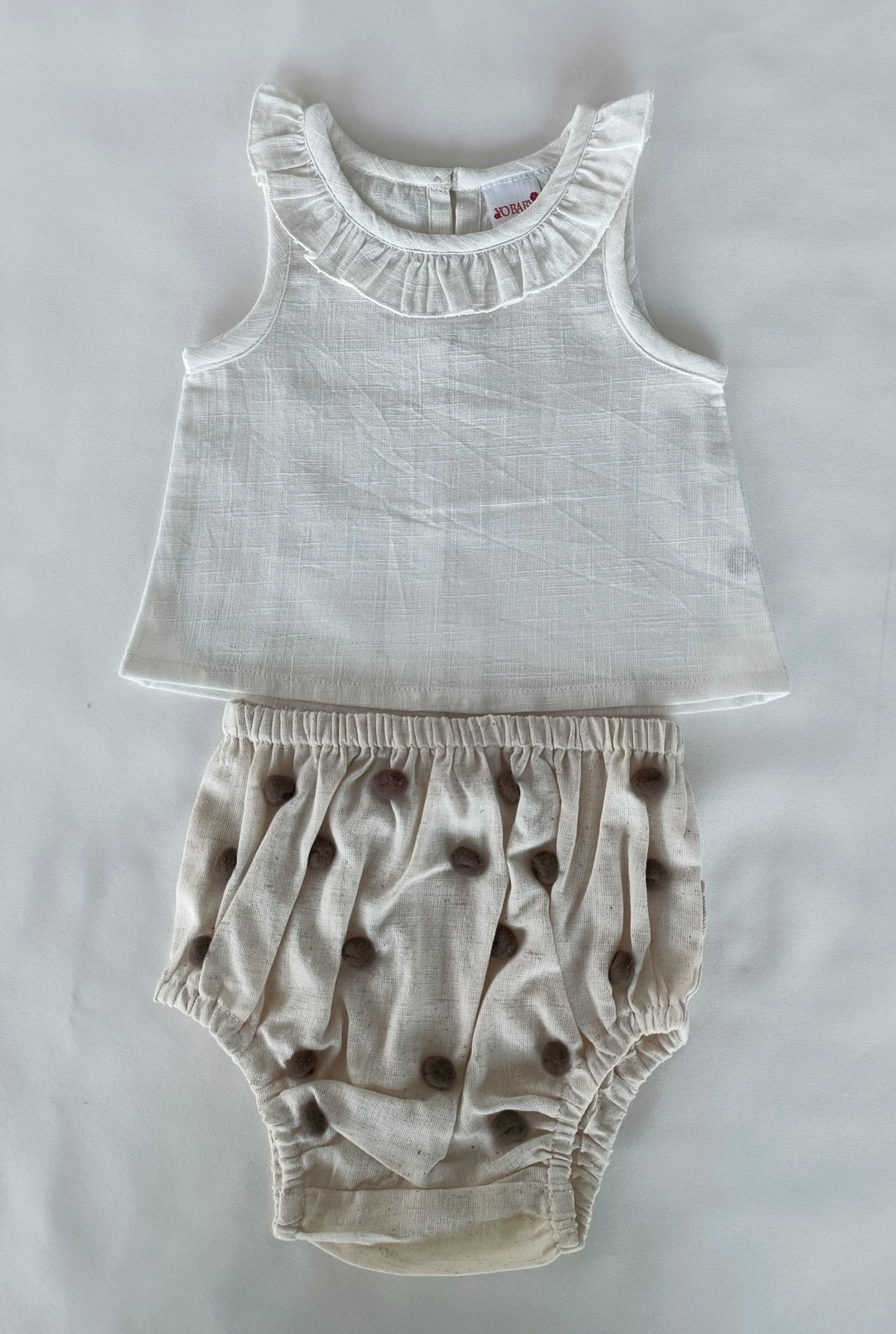 White Ruffle Neck Top & Ivory Diaper Cover With Pom-Poms