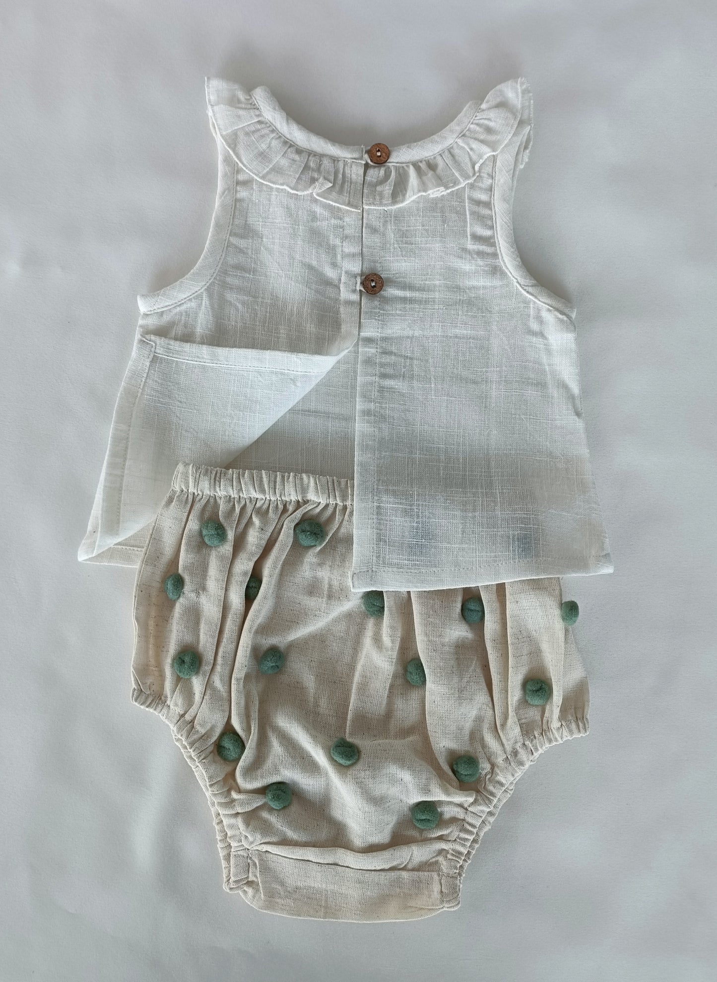 White Ruffle Neck Top & Ivory Diaper Cover With Pom-Poms