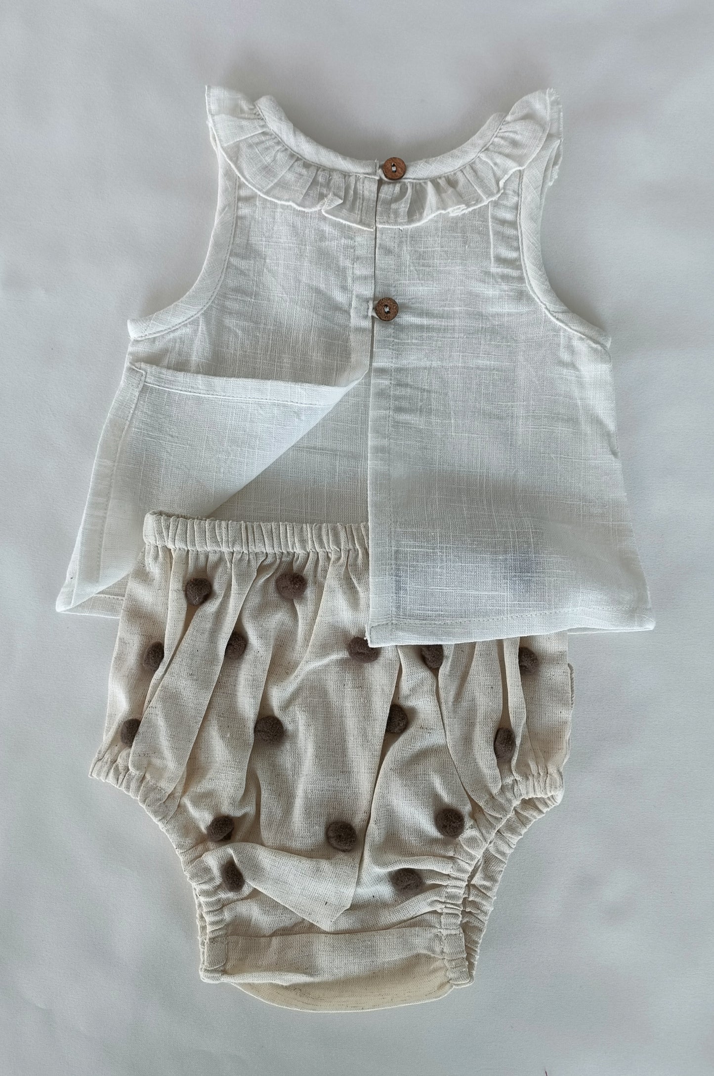 White Ruffle Neck Top & Ivory Diaper Cover With Pom-Poms