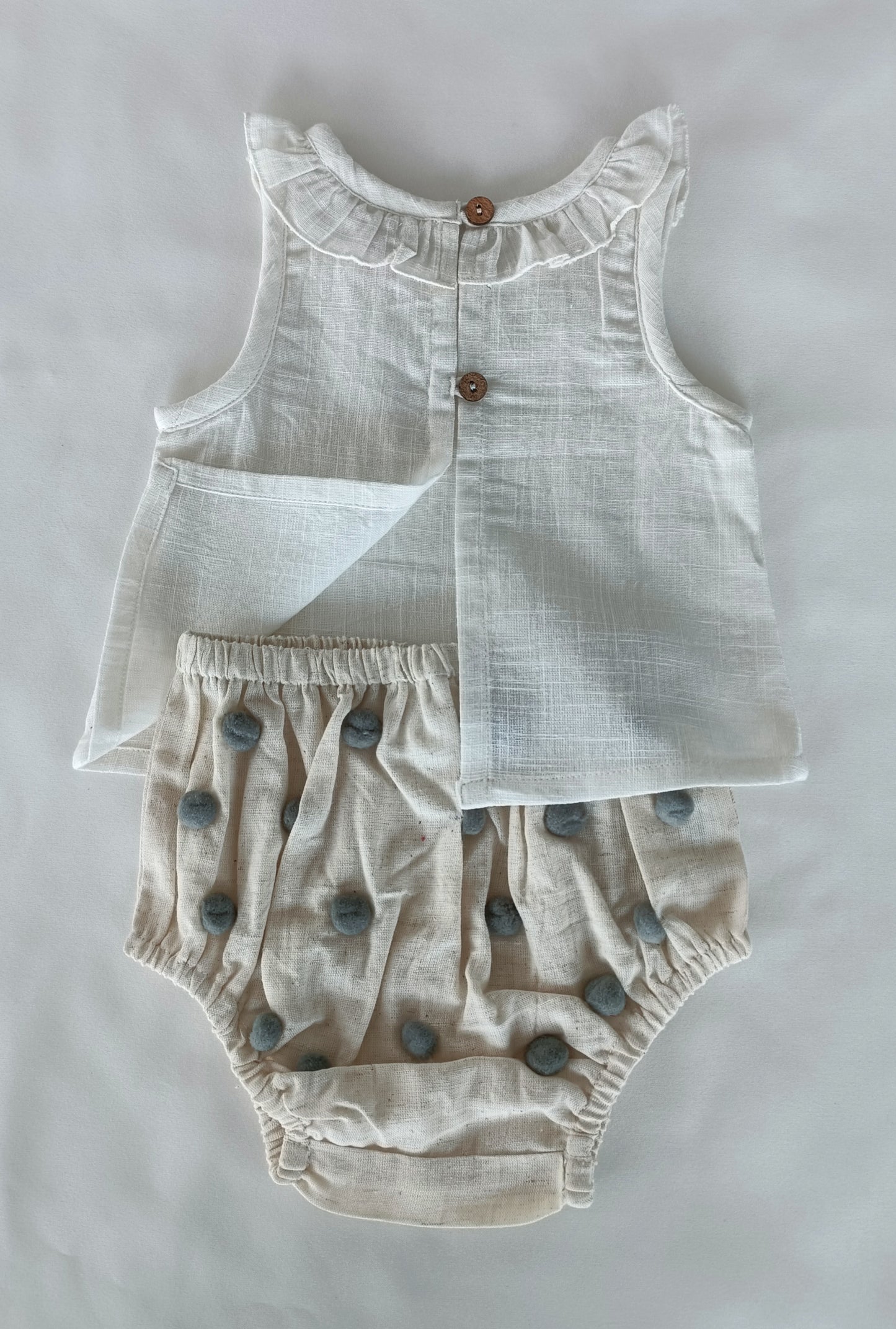 White Ruffle Neck Top & Ivory Diaper Cover With Pom-Poms
