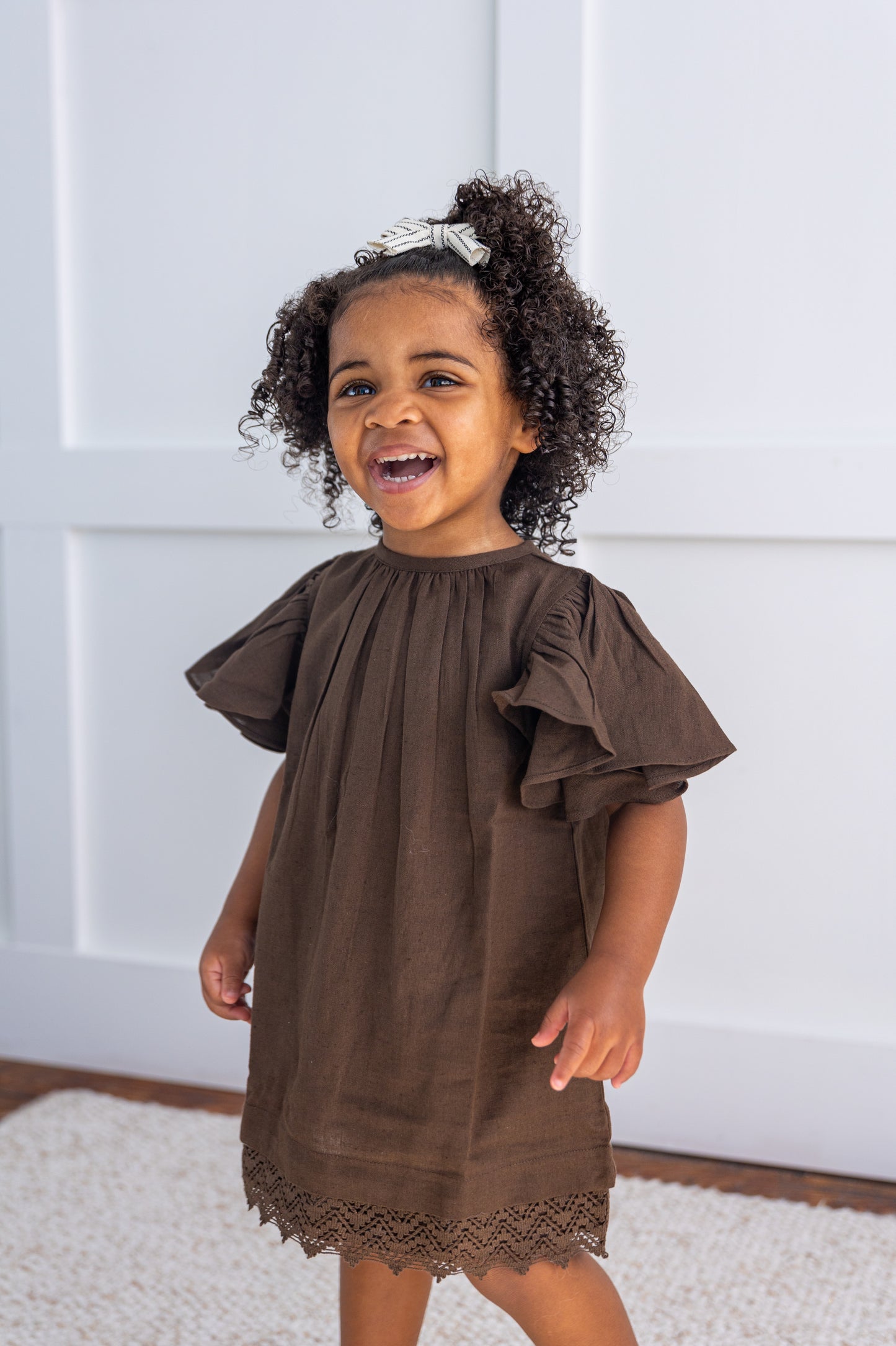 brown toddler dress Charlotte Premium Girls - Chocolate a decorated belt at the waist and a full tulle skirt outlining the hem of the skirt with three layers of 3D flowers Back zip enclosure and cotton lined for your princess comfort. Chocolate Brown Sleeve and Neck